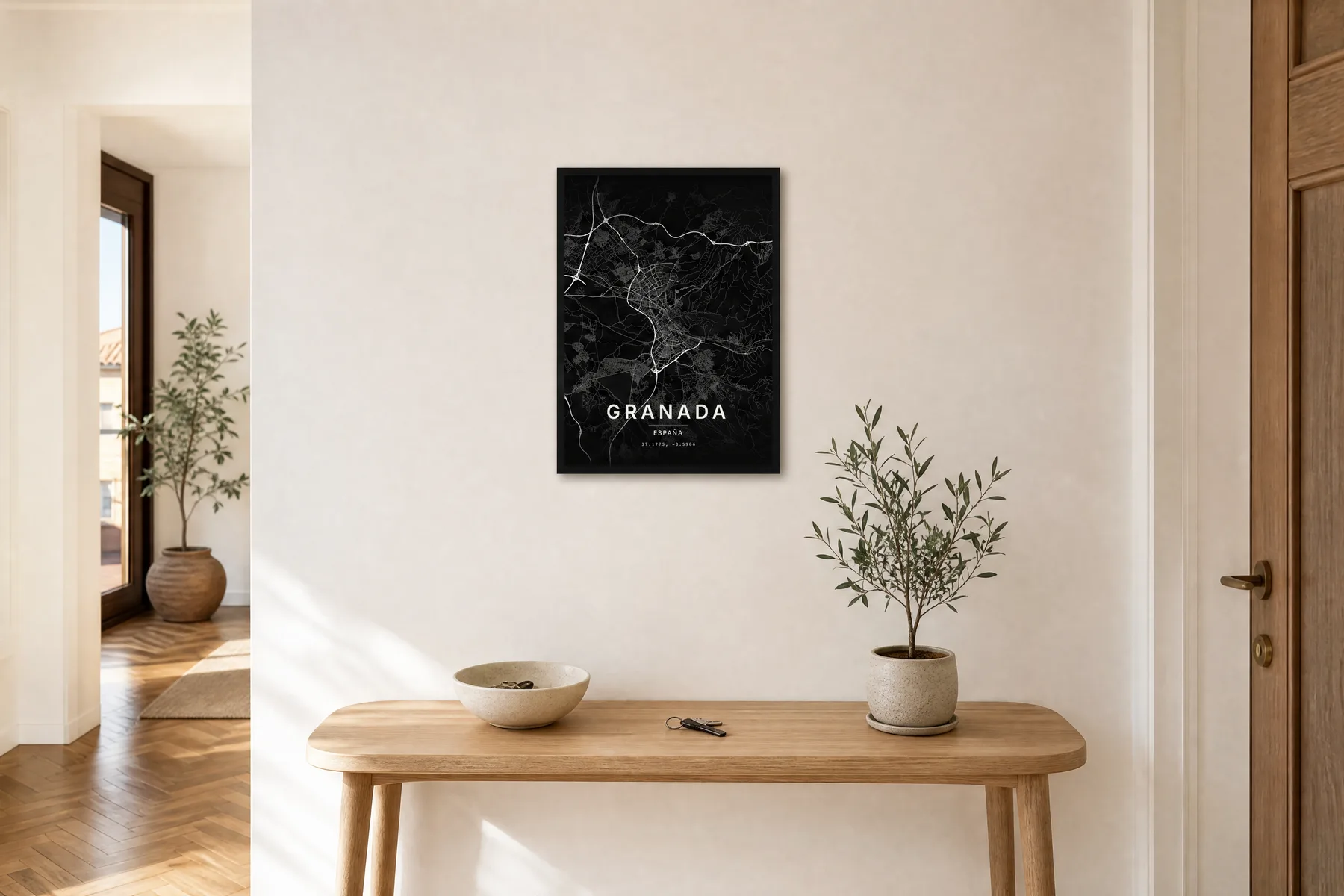 Mapa negro de Granada de 30x40 cm con marco negro sobre una consola de entrada